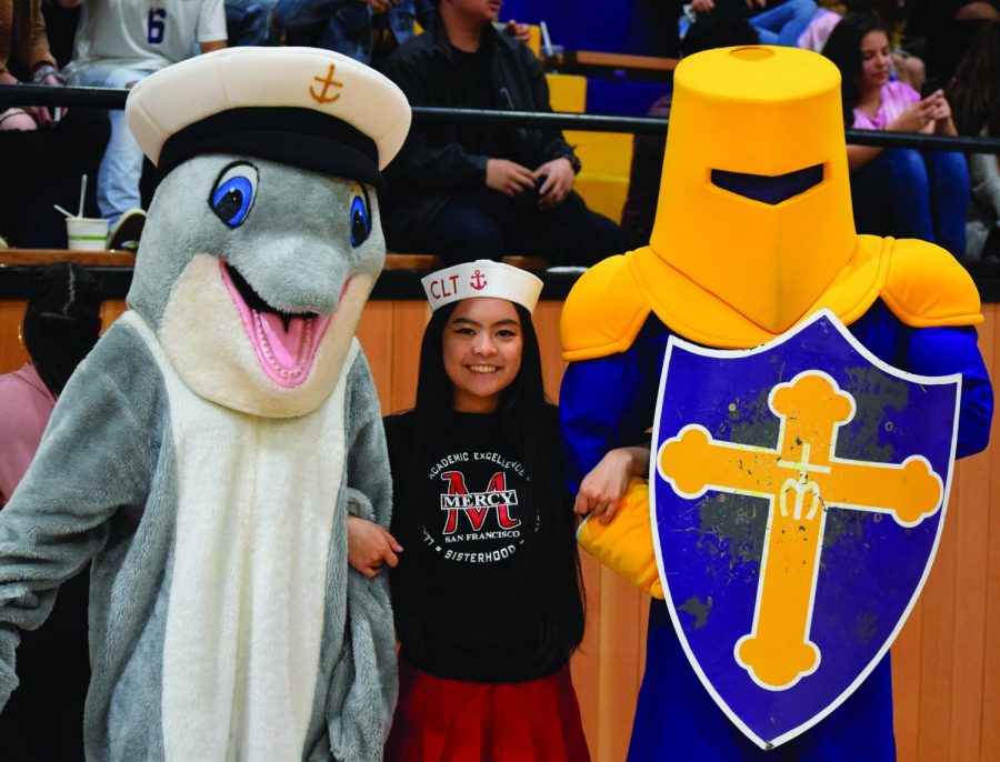 The Mercy and Riordan mascots pause for a smile before the games.