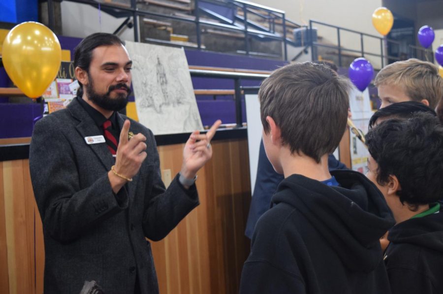Social Science Department Chair Chris Fern talks to prospective
Riordan students about history at Open House this past October. 
