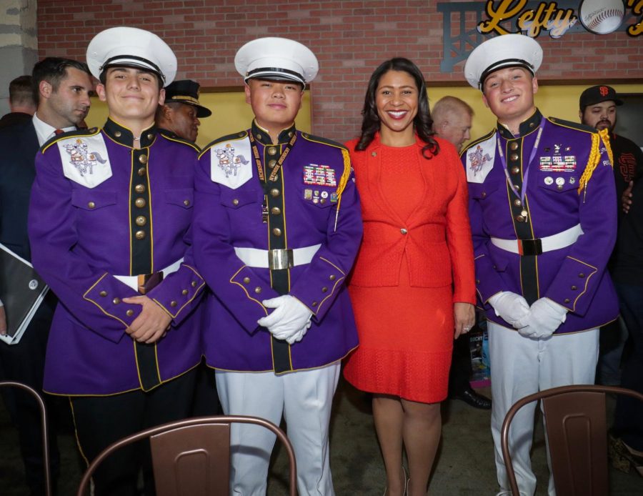 Adam Kolokotrones ’20, JP Jacinto ’19, and Zachary Phillips ’20 pose with
San Francisco Mayor London Breed after their performance at Lefty O’Doul’s. 