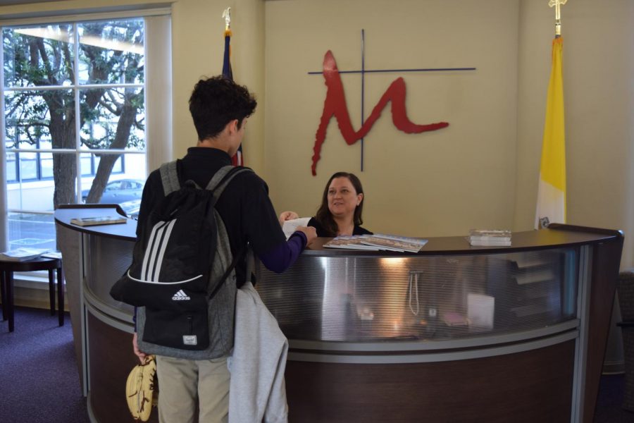 Late students now check in at the front desk with Nora Birmingham.