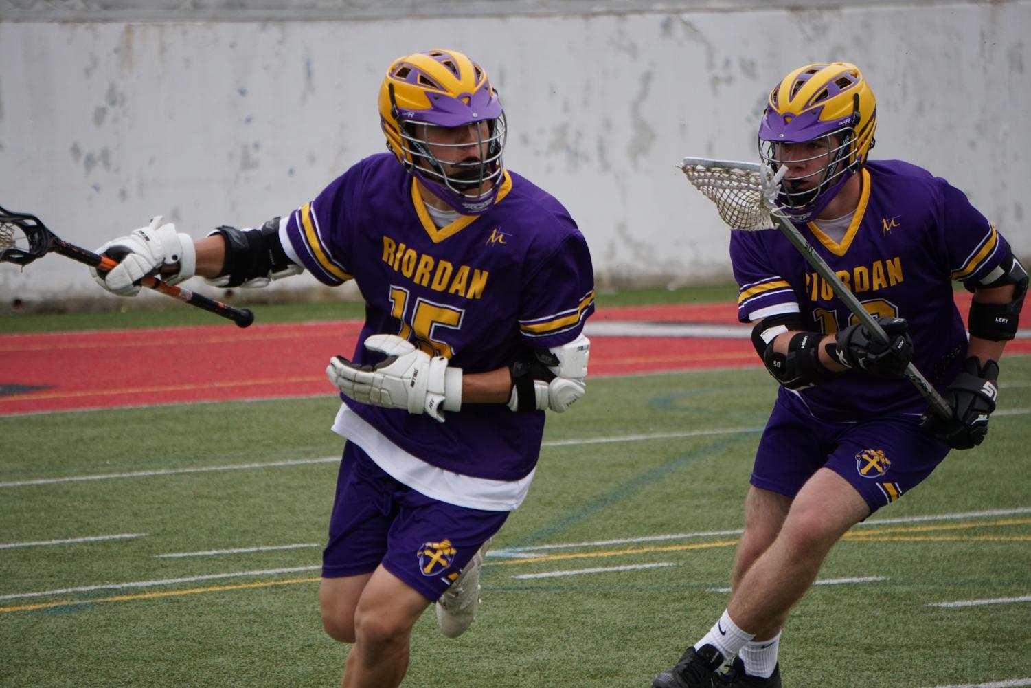 Jared Lindenmuth ’19 (left) and Alonzo Ball ’21 prepare to score.