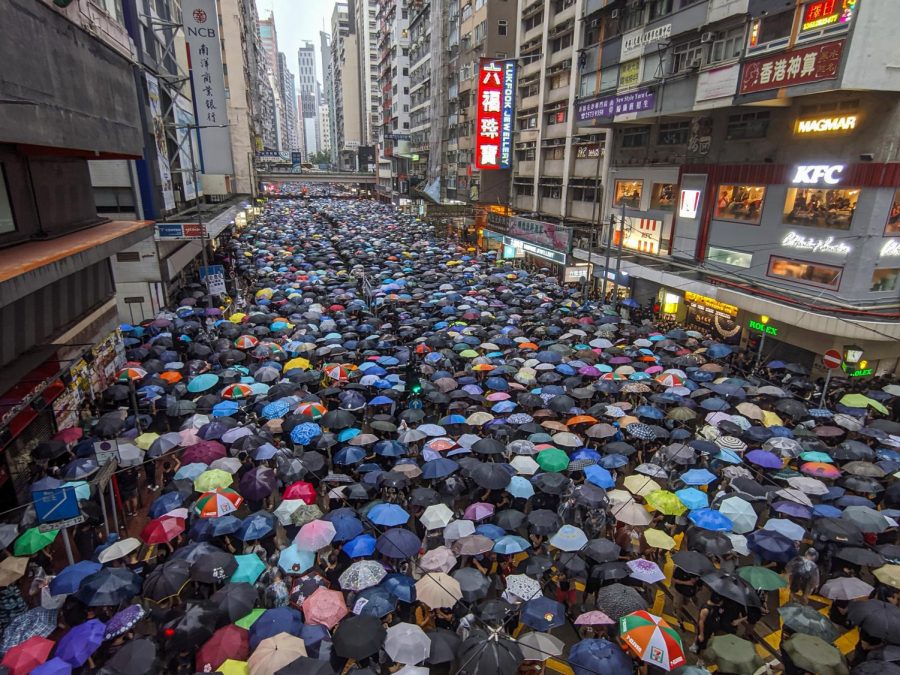 Thousands+carry+umbrellas+on+the+streets+of+Hong+Kong+to+protest+the+Fugitive+Offenders+amendment+bill+by+the+Chinese+government.