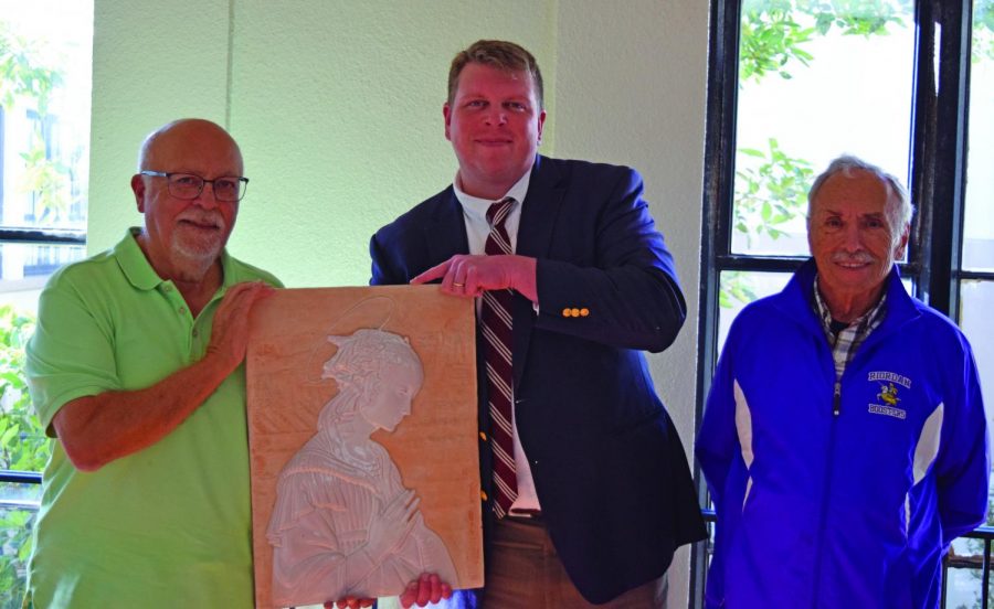 Chuck Murillo ’55 donated a piece of artwork to Riordan, which President Andrew Currier graciously accepted. Paul Osborne ’55 accompanied his classmate to their alma mater for the event.