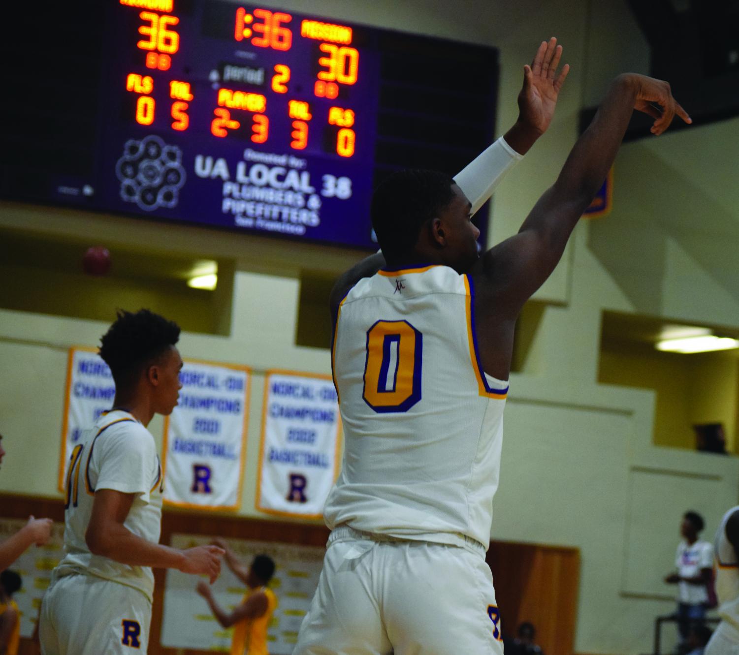 The Riordan varsity basketball team warms up for the new season.