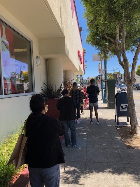 A lengthy line forms outside the Target on Ocean Ave in San Francisco.