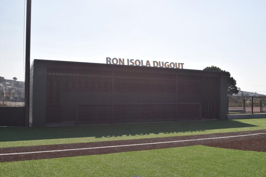 After the renovation of the baseball field, the Crusaders’ dugout was named in honor of teacher, coach, and mentor Ron Isola ’61.