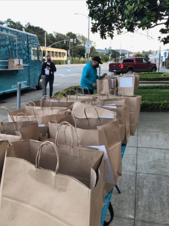 Dozens of food orders wait to be picked up in front of the school on
Jan. 29, the first of three days the catering truck accepted pre-orders
in a fundraiser for Archbishop Riordan that collected nearly $1,000.