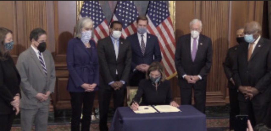 Speaker of the House Nancy Pelosi signs the articles of impeachment
against former President Donald Trump for the second time.