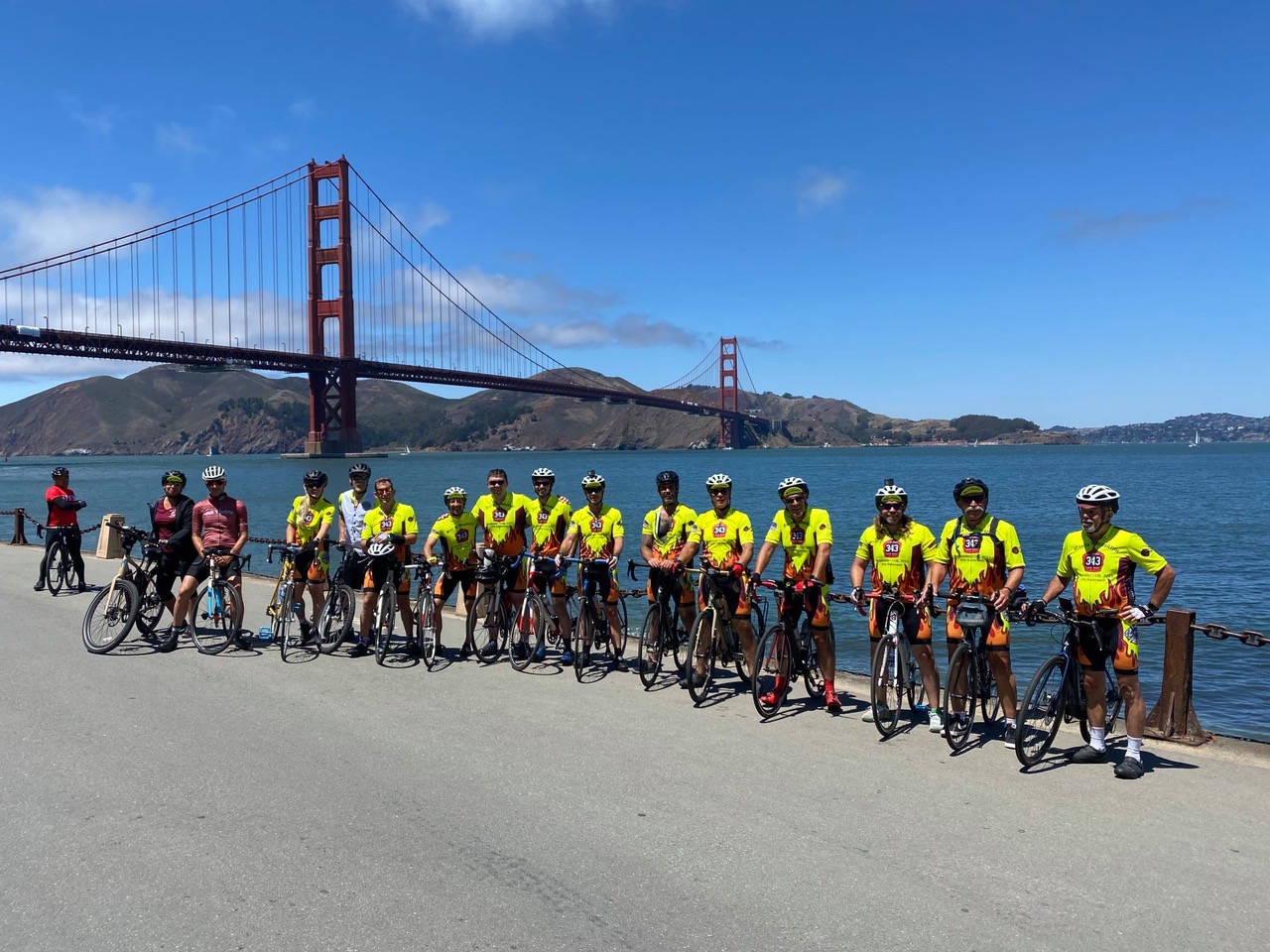 Frank Walsh '67 and fellow retired and active firefighters stand in front of the Golden Gate Bridge before leaving on their Bay to Brooklyn bike ride to commemorate the more than 300 firefighters who died on 9/11. 