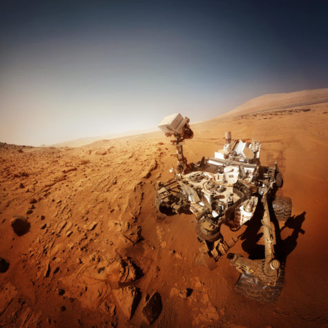 Mars rover collecting samples to bring back to Earth.
