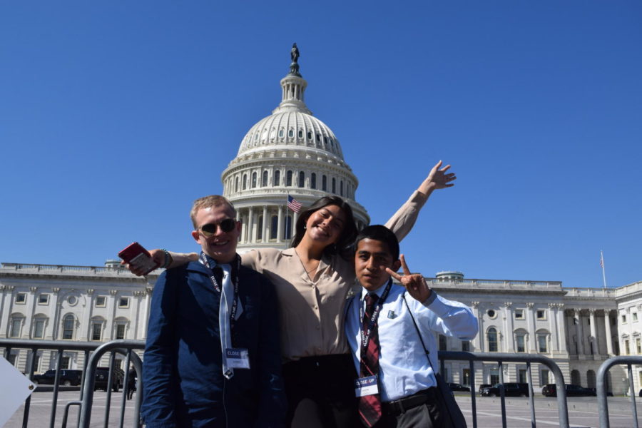 Andrei Lynch ’22, Sophia Carrasquilla ’22 and Joseph 
Zuloaga ’23 pose in front of Capitol Hill before meeting 
with a representative from Sen. Dianne Feinstein’s office.