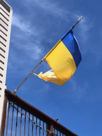 The Ukrainian flag is displayed outside a house in the Sunnyside neighborhood. 