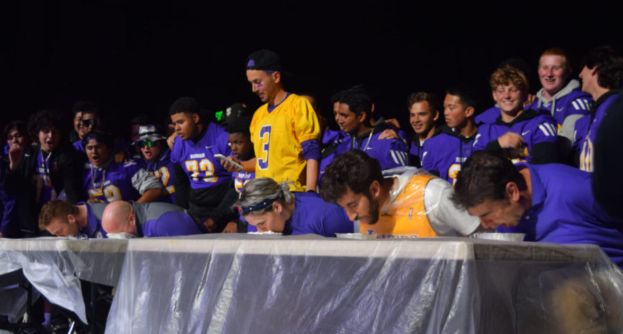 Coaches+participated+in+a+pie-eating+contest+at+the+Purple+and+Gold+Homecoming+Rally.