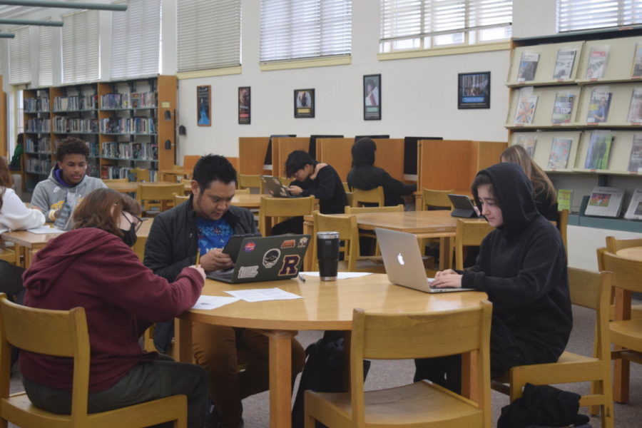 Students and teachers use the library to study, work, or hold office hours.