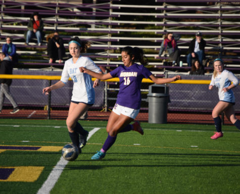 Cienna Lujano ’26 battles an opponent in home game.