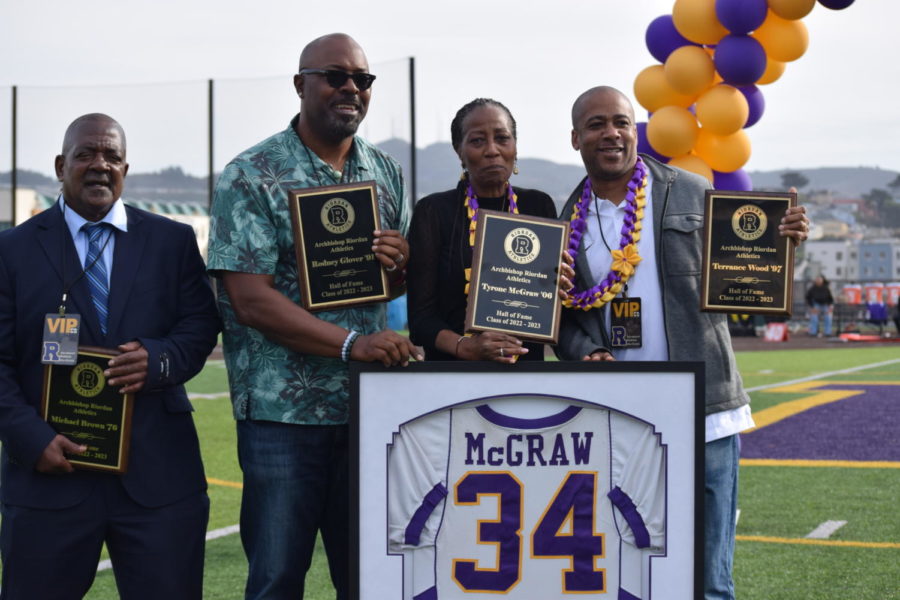 Michael Brown ’76, Rodney Glover ’91, Tyrone McGraw’s godmother Cherrell Hallett, and Terrence Wood ’97 received plaques for the 2022 Hall of Fame.