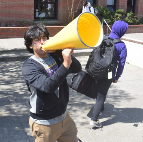 Santino Martinez 24, Spirit Captain, uses a giant megaphone to encourage students to join the Spirit Club. 
