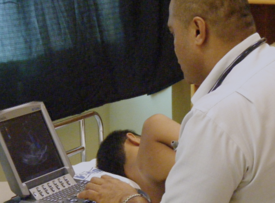 A nurse administers an electrocardiogram (EKG) to a child.