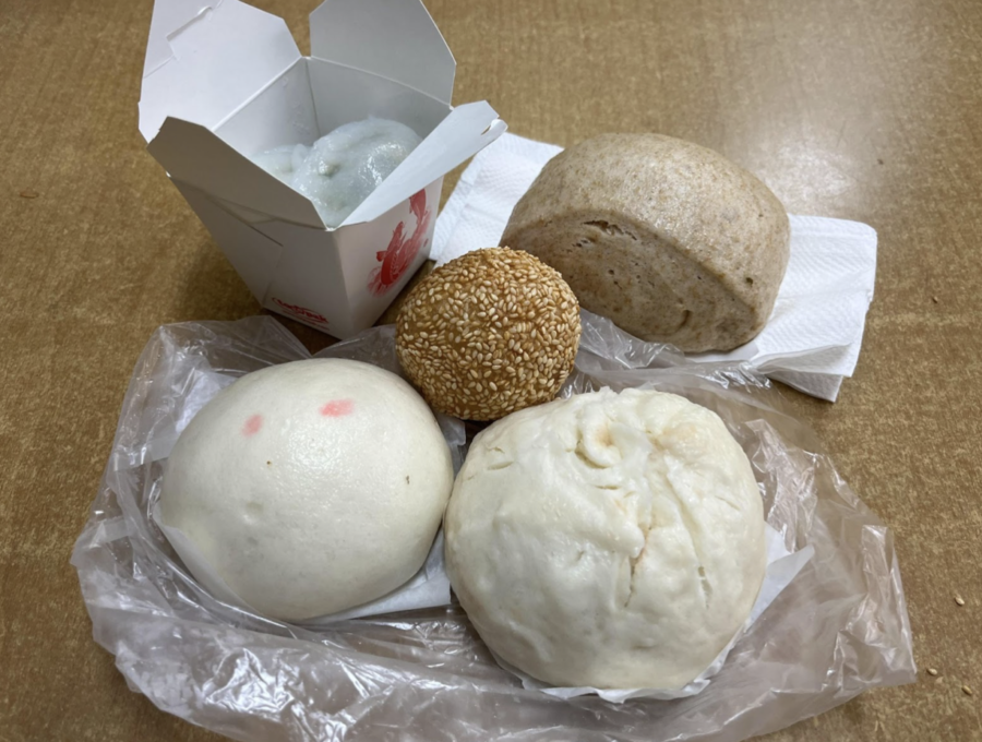 Items from Sweet Delight Bakery in the Excelsior District include a BBQ pork bun, sesame ball, wheat steam bun, and an egg custard.