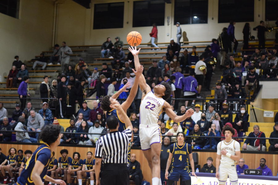 Christian Wise ’23 outleaps an opponent at the tip off against Inderkum
