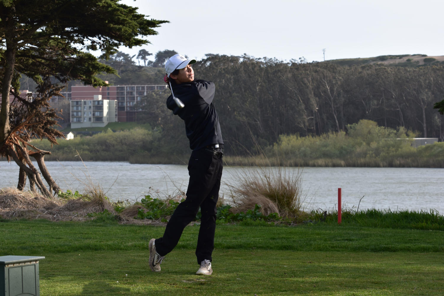 Alden Thai '25 tees off during the game at Lake Merced's Harding Park.