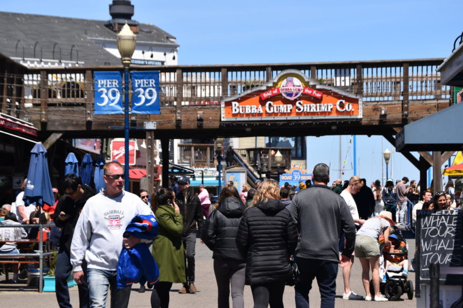 Tourists walk around Fishermans Wharf to get a taste of the San Francisco experience.