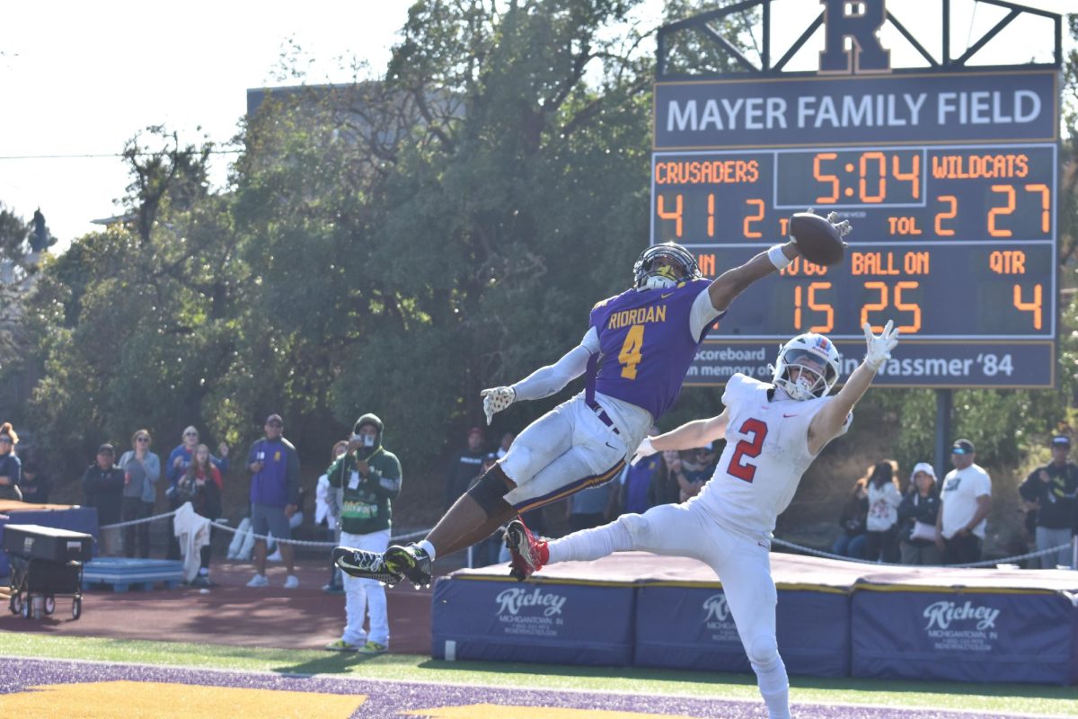 Chris Lawson ’25 makes a spectacular deflection against the S.I. Wildcats at
Mayer Family Field. The Crusaders won 41-34 to regain the Haskell Trophy.