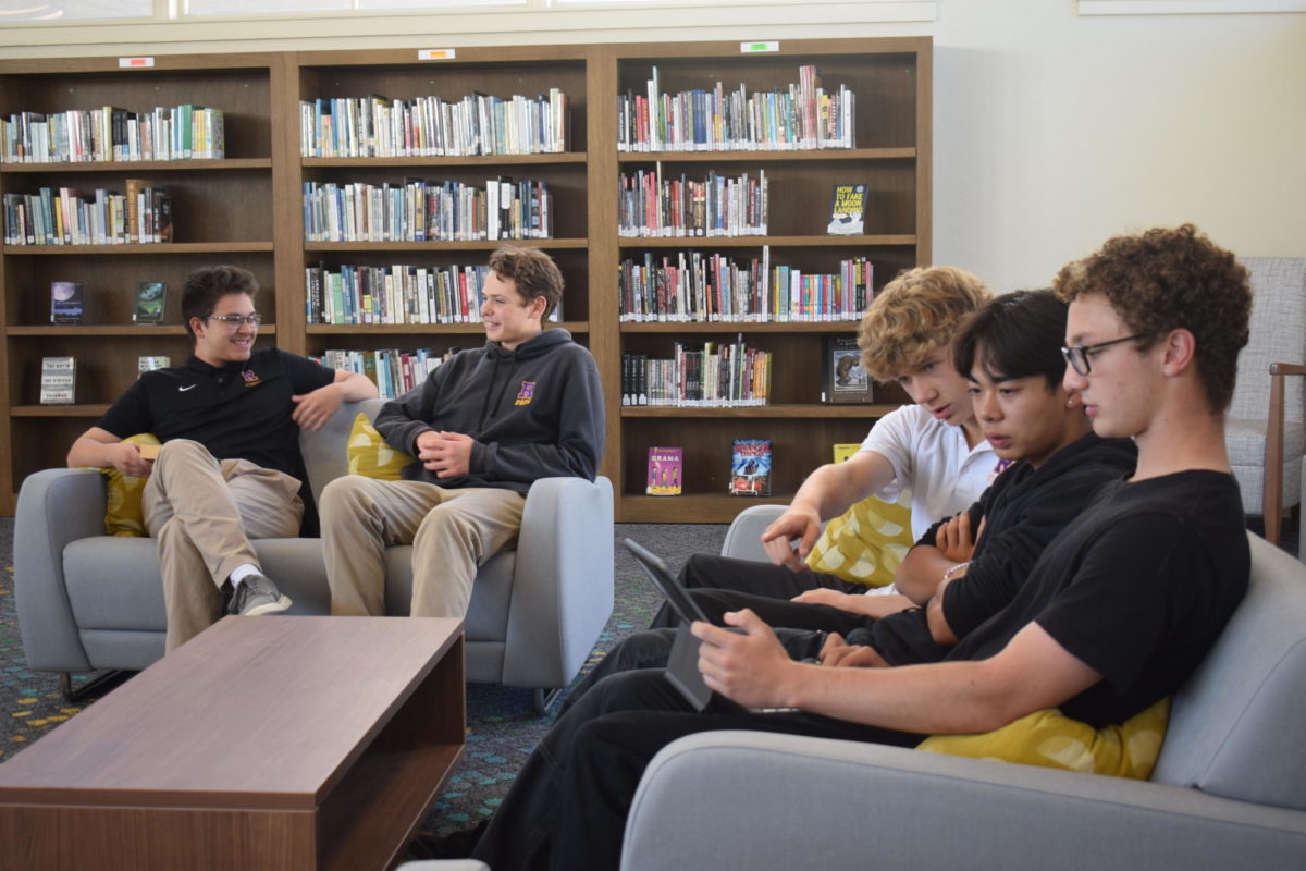 Students gather in the remolded library to relax and work on assignments.