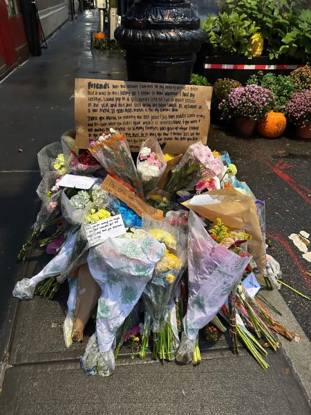 Fans of the TV show “Friends” left flowers for the late Matthew Perry, creating a memorial in front of the iconic apartment building from the show.
