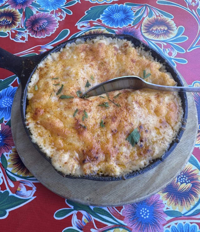 Freshly-baked macaroni and cheese served on a skillet.