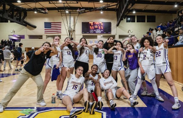 Members of the girls Varsity Basketball team pose for phot after CCS win against Saint Francis High School.
