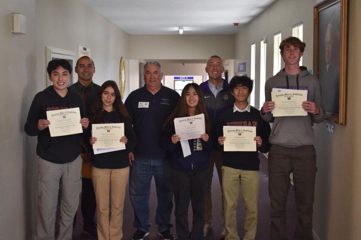 Five students received awards for their essays in a contest sponsored by YMI. 