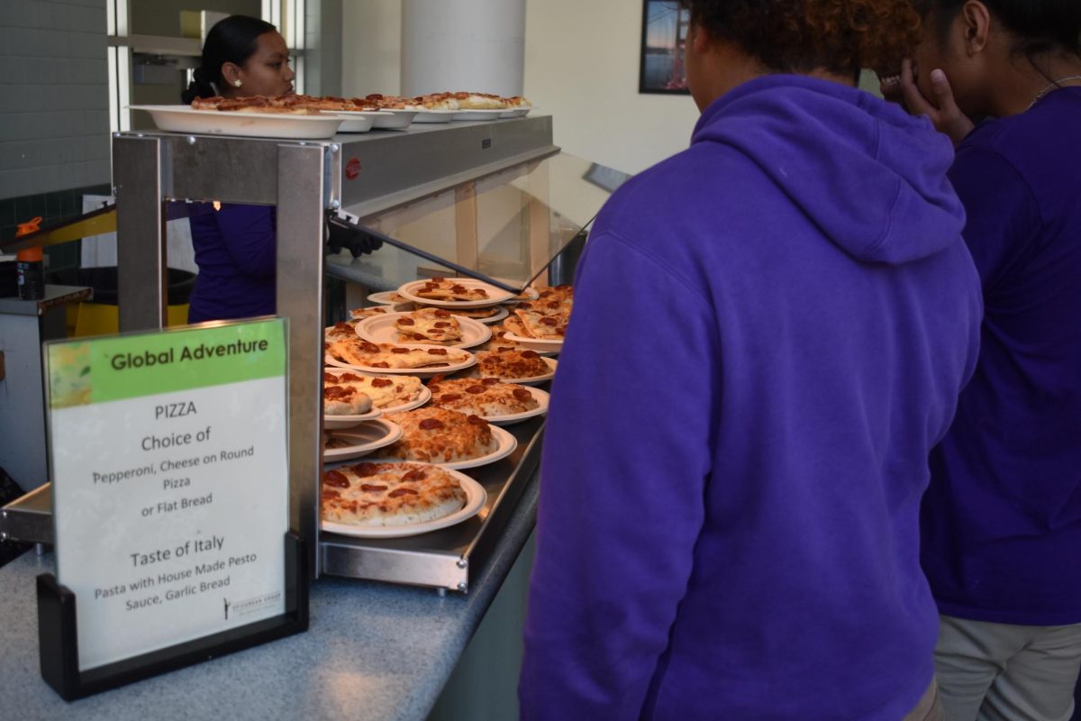 Excessive cheese on the pizzas is whats causing all the smoke, asserts a cafeteria worker. 
