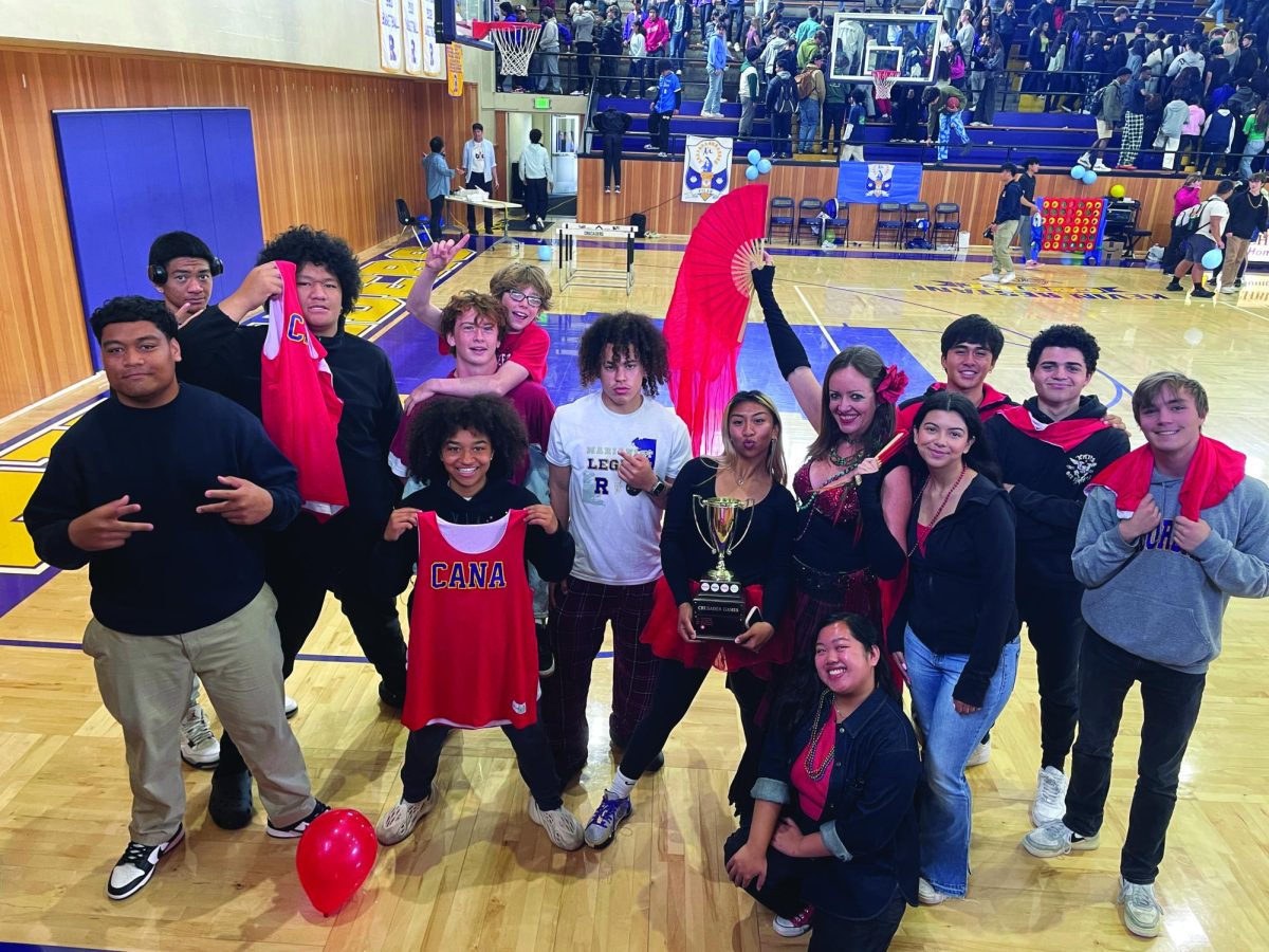 Members of the House of Cana, along with Provincial Colleen O'Rourke, celebrate with the trophy after winning another Crusader Games this month. 