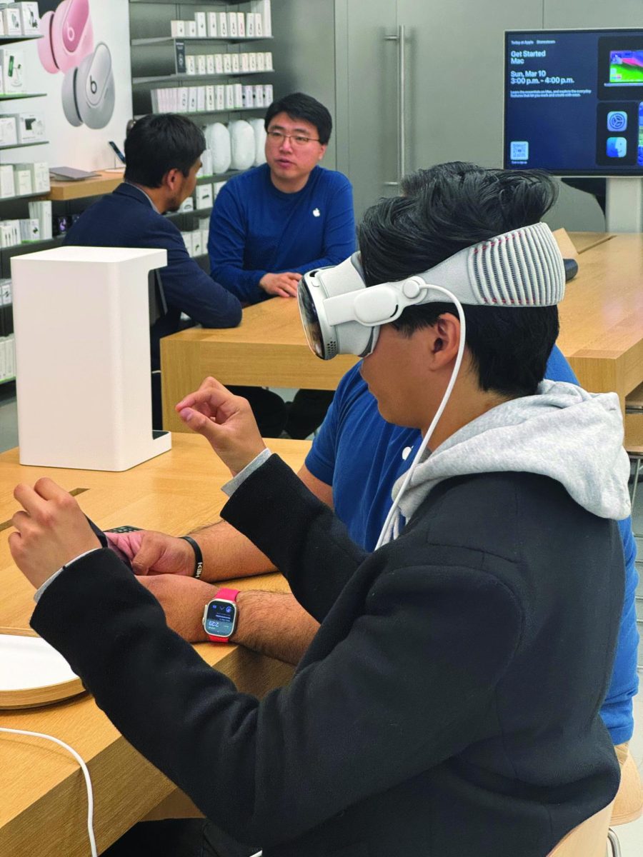 Aiden Pavon ’25 tests out the new Apple Vision Pro, which costs $3,500.