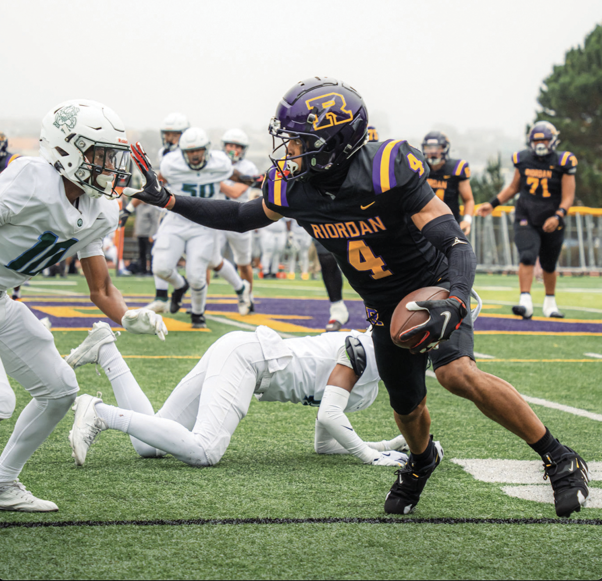 Wide Receiver Chris Lawson ’25 runs the ball in a home game against SHC.