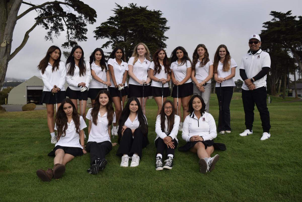 The Riordan girls golf team pose for a photo with their coach, Abe Parnall '95