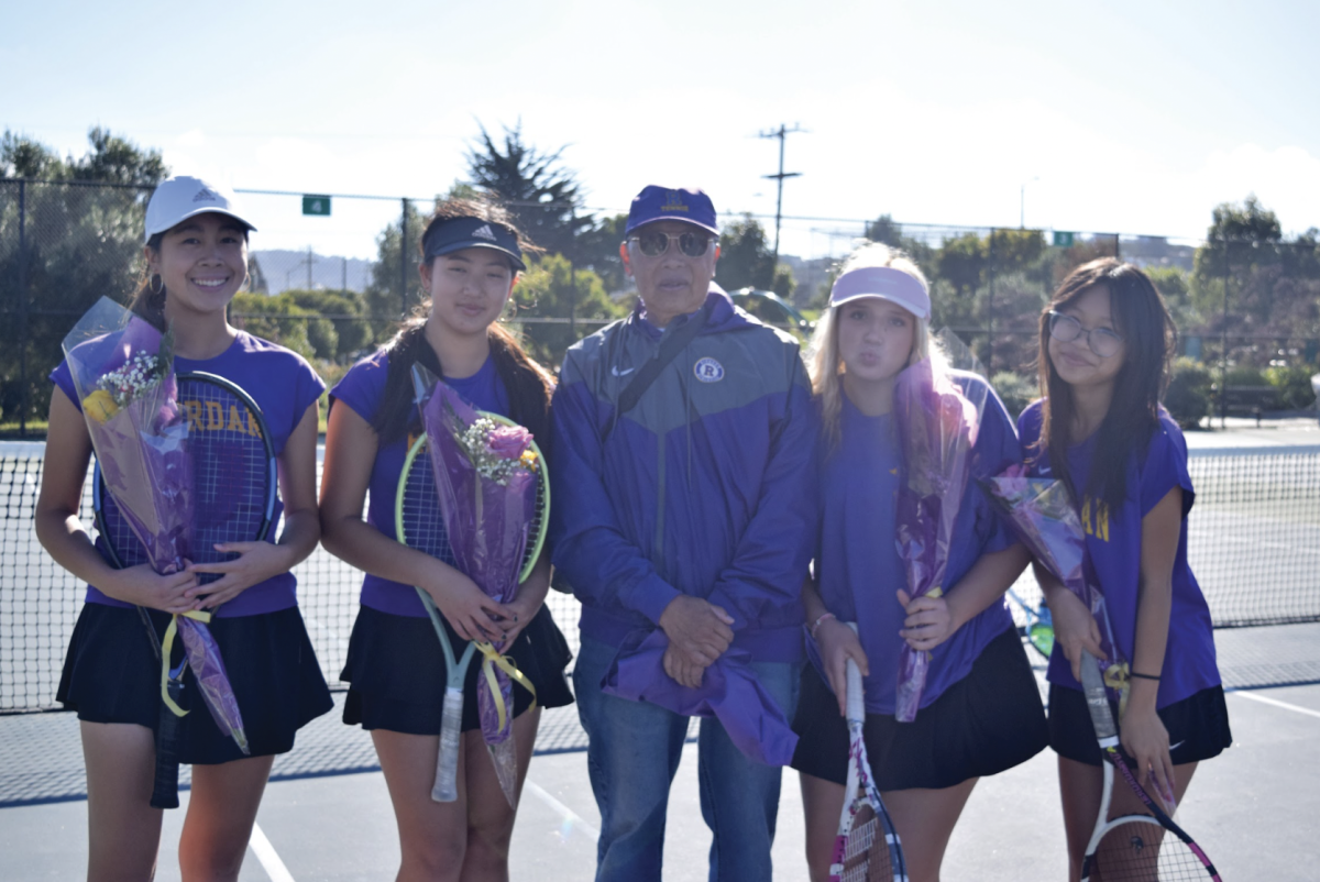 Tennis players Kellie Wong '25, Haley Hang '25, Genevieve Kohlmyer '25 and Taylor Tran '25 celebrate Senior Day with their coach Raymond Wong. 