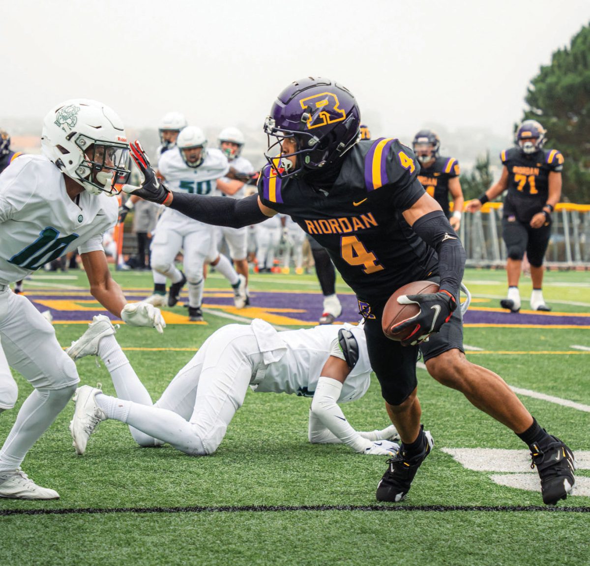 Chris Lawson ’25 runs the ball down field in a game versus Saint Francis.