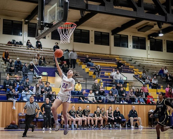 Maxine Sutisna ’25 goes for an unchallenged layup against Mitty High School.