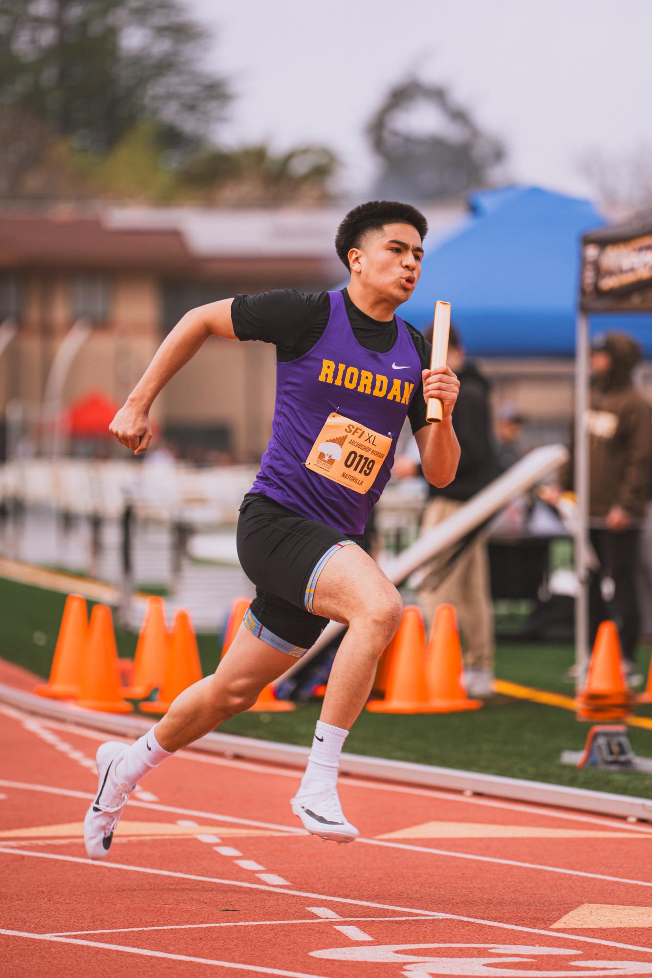 Ellison Natorilla '27 takes off in a relay race at the St. Francis Invitational.