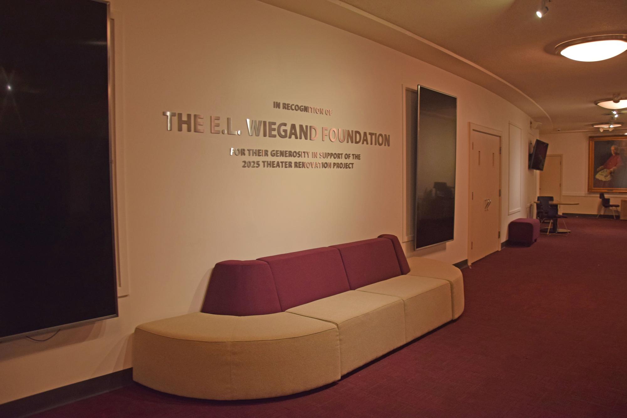 In addition to new seats and carpeting, the theatre lobby received new paint, furniture, and signage honoring the donors who made the renovations possible. 