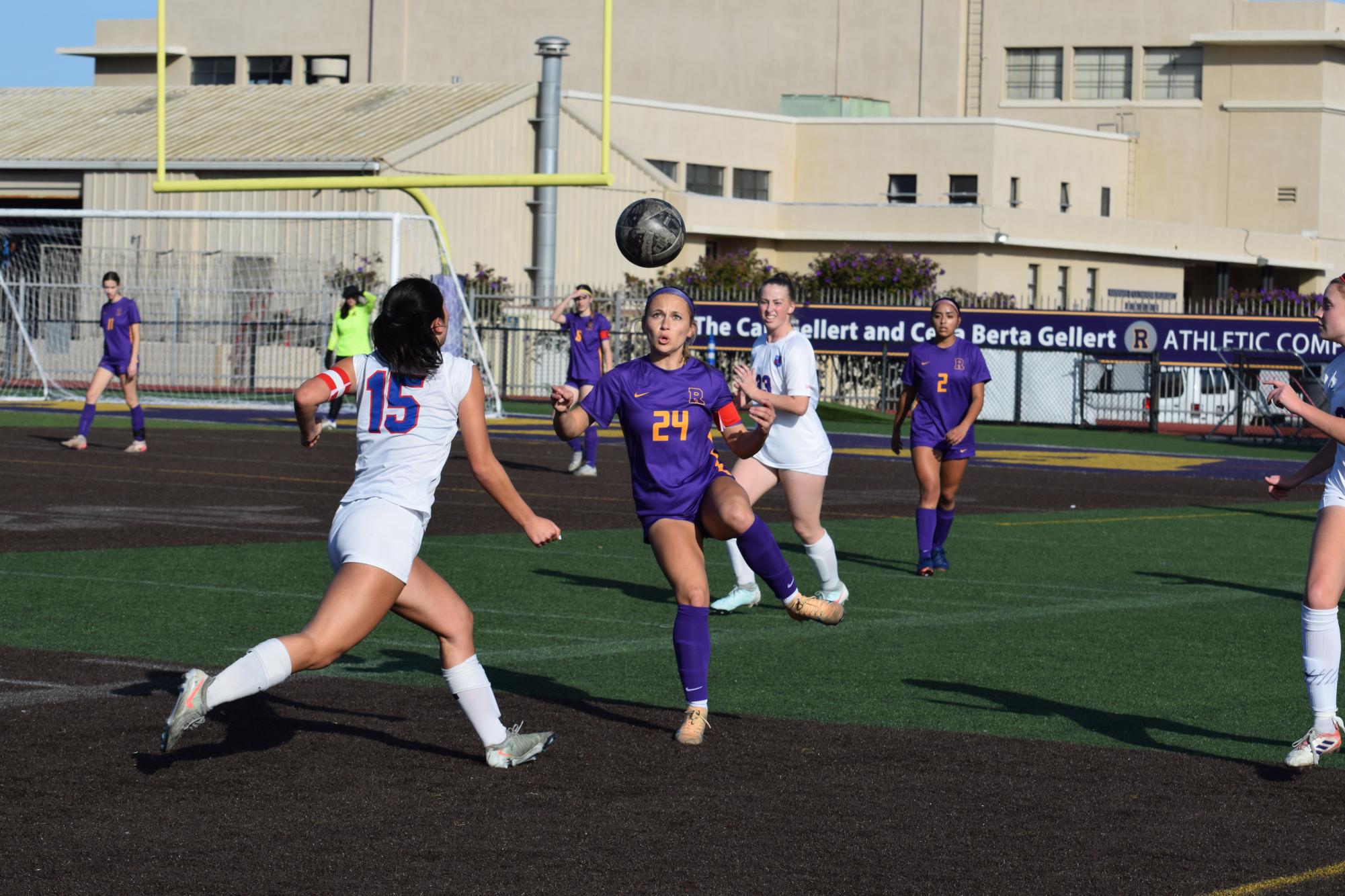 Captain Carmen Giuffre '27 battles for possession of the ball against rival SI. 