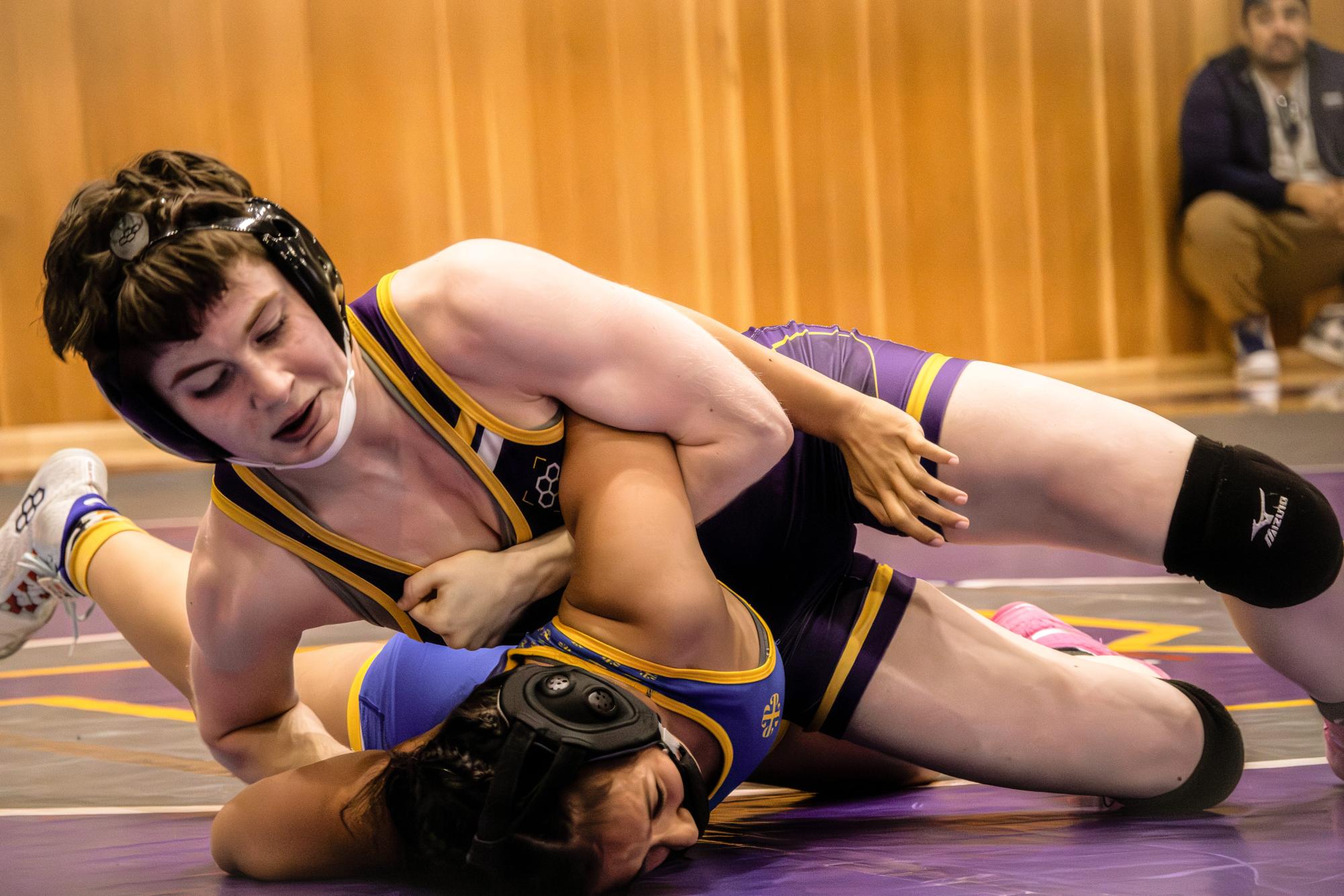 State bound North Region finalist Georgie Michalchuk ’26 pins her opponent during a duel at home vs. Presentation and Bellarmine.