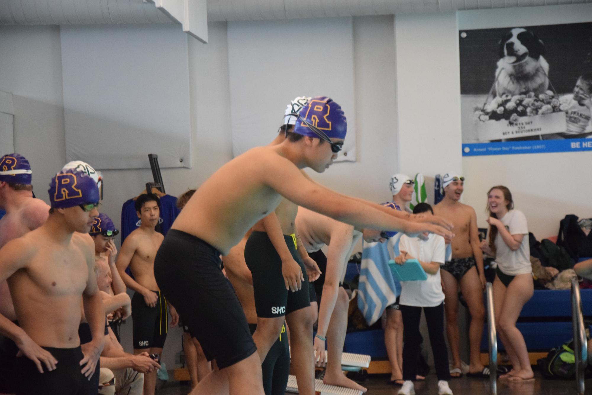 Darby Powell ’28 prepares to dive at a competition against SHC.