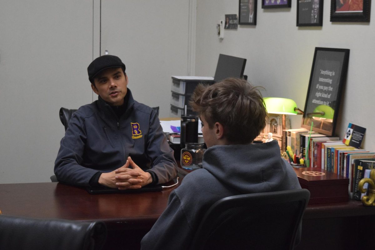 Changes regarding the usage of Artificial Intelligence (AI) in school were made to adapt to its growing usage. Here, Dean of Academics Christopher Fern models a discussion about honor code violations with a student in his office.