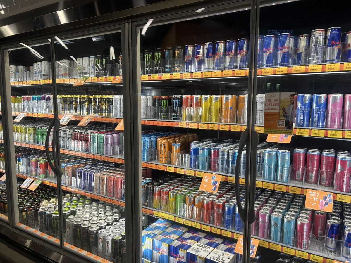 A refrigerator stocked with energy drinks reflects their growing popularity while raising concerns about their potential long-term health risks today.
