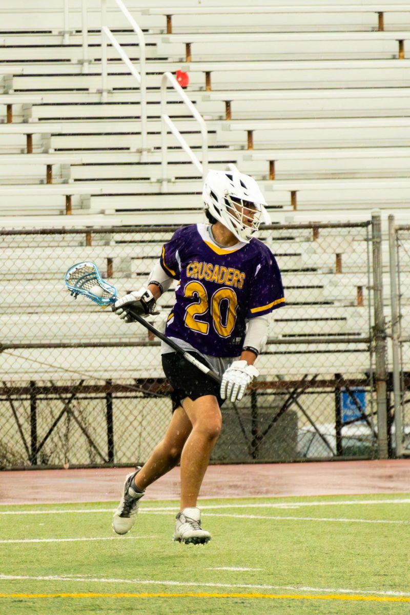 Donavon Mufsin ’26 sprints down the field in a game versus Oakland Tech.