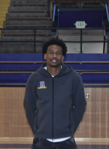 Andrew Hilman ’26 stands in the Crusader Forum, recalling memories of
late-night workouts, hundreds of practices, and games with sold out stands.