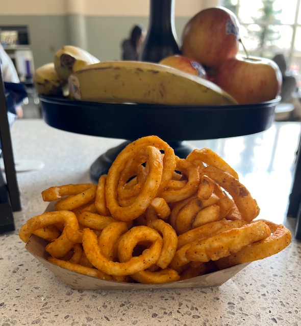 Curly fries are among the different types of fries served in Riordan's cafeteria. 